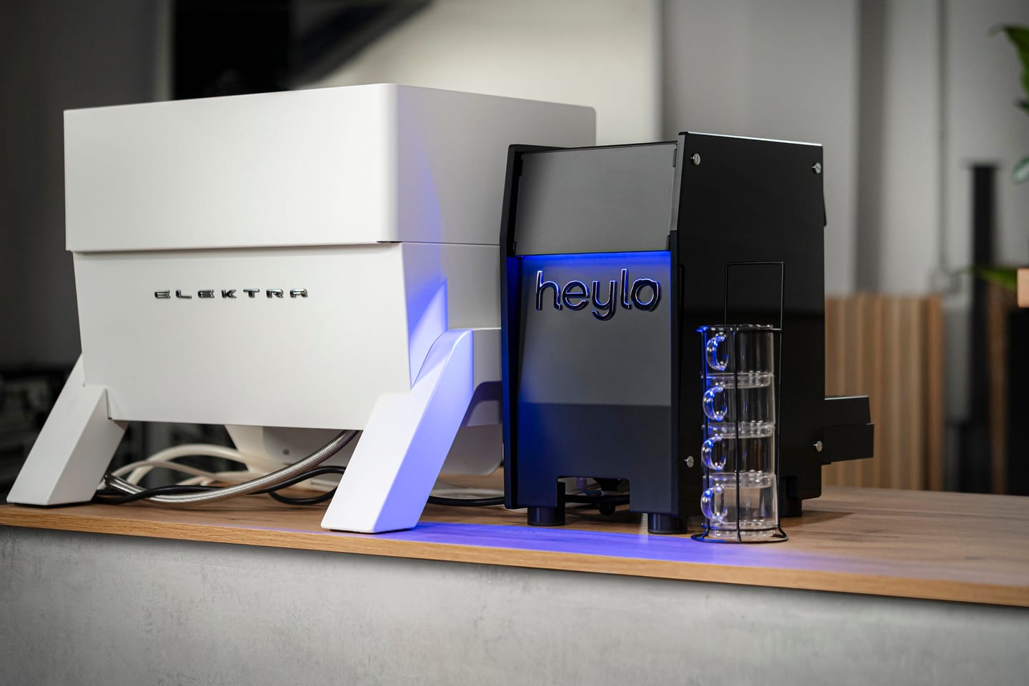 HeyMilky on a bar counter next to an Elektra espresso machine